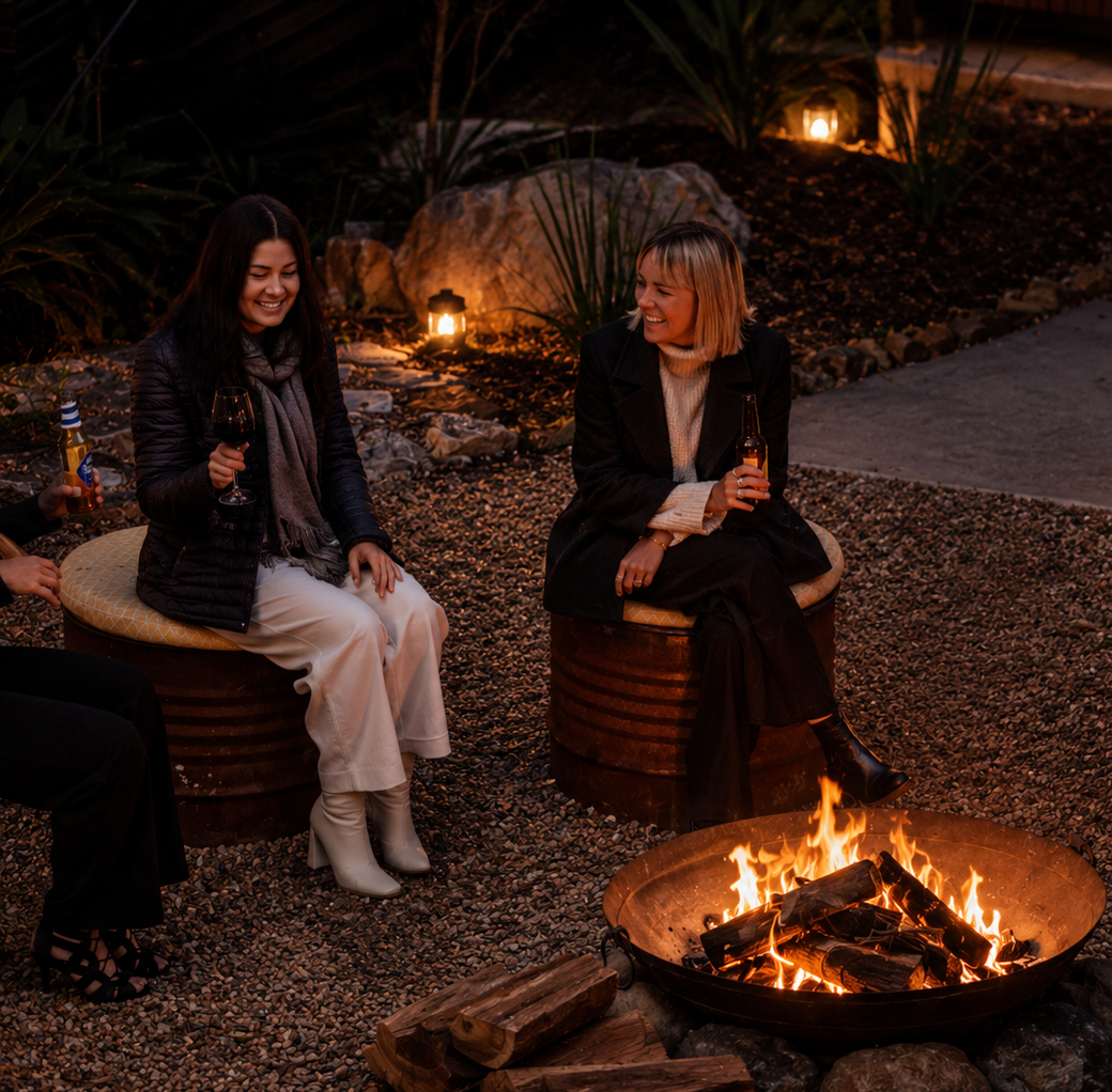 Guests enjoying an evening around the fire pit at Tamborine Mountain Glades